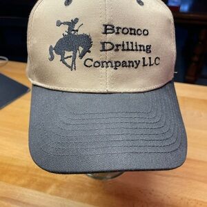 Vintage Bronco Drilling Company LLC Tan and Black Nissun Hat
